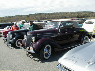 Side by side 1936 Ford cabriolets. The one behind has been lowered.