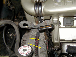 Alternator from front of car. Arrows show where two of the wires had been connected.
