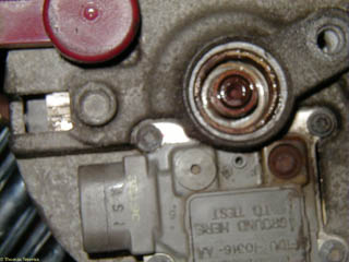Detail of rear bearing on old alternator. The dust cap over the bearing was already gone.