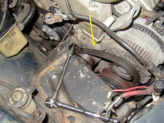 It may be easier to move the drive belt above the idler pulley before trying to remove the belt from the alternator